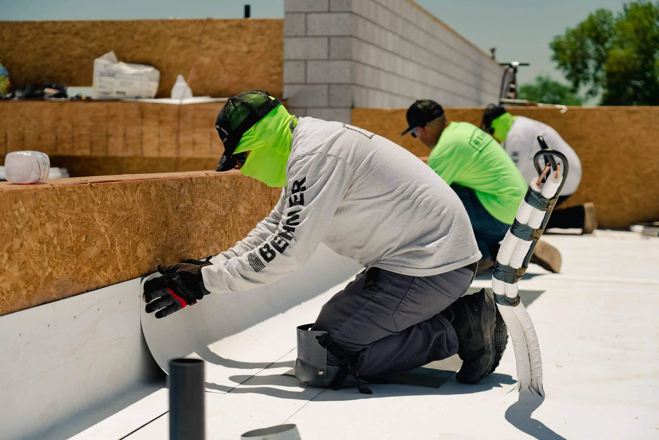 beher roofing company employees working commercial roofing services in gilbert az