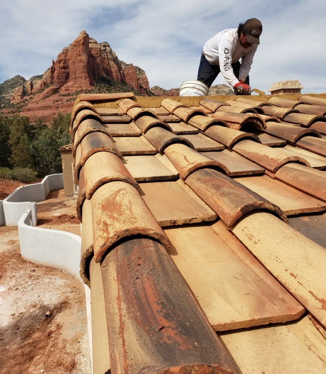 tile re roof being done by worker phoenix az