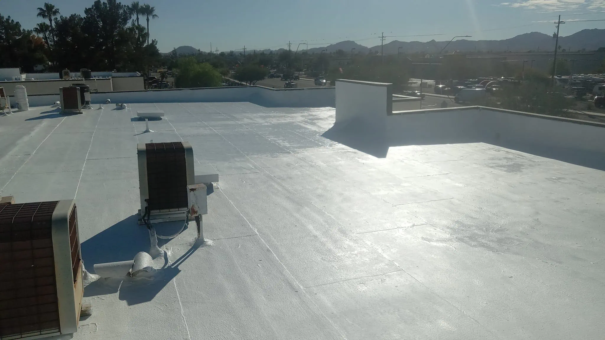 acrylic roof coating on commercial building in phoenix by behmer