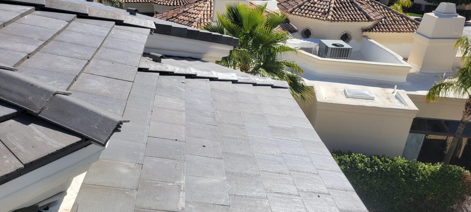 A black tile roof undergoes re-roofing in Scottsdale.