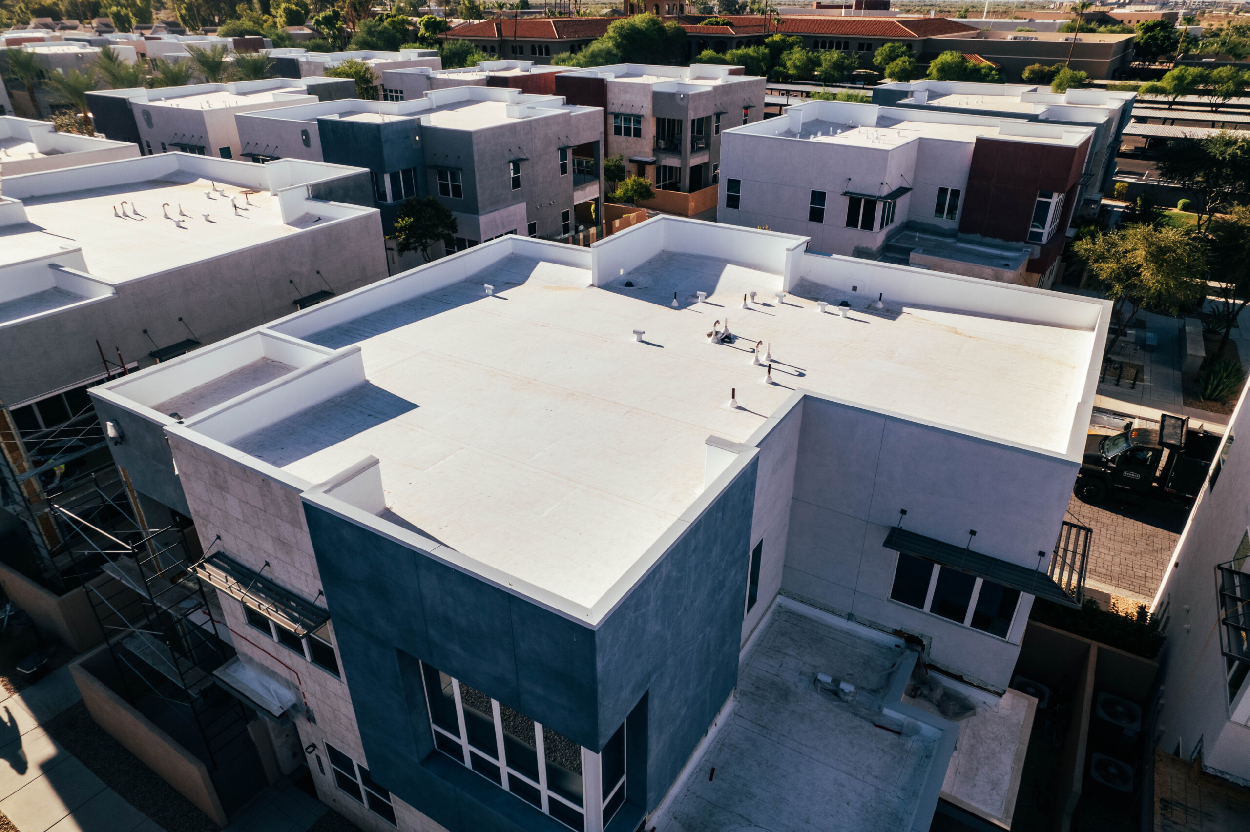 An aerial view of a group of houses featuring spray foam insulation and coating installation in Phoenix.