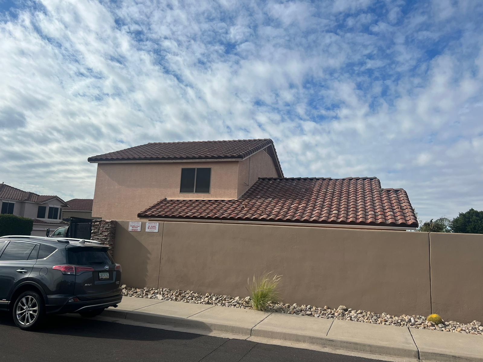 Side view highlighting a roof in Tempe slated for tile replacement.