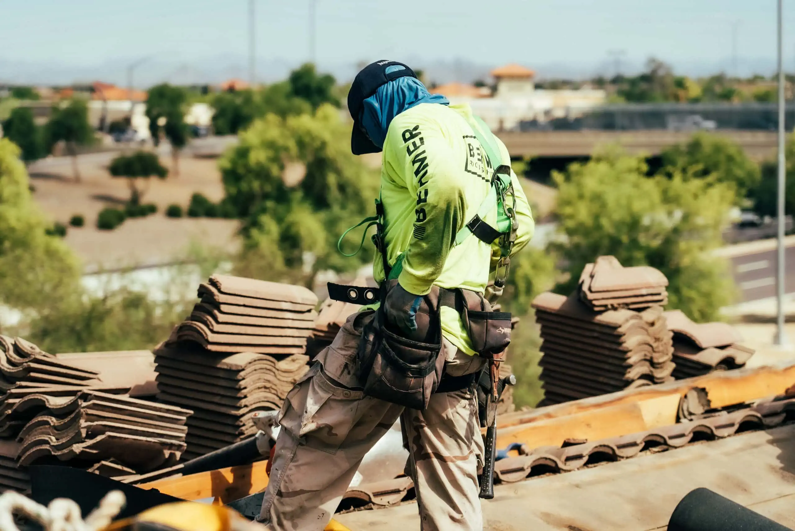 Roofing technician securing tiles during a re-felt project in McCormick Ranch.